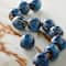 12 Packs: 11 ct. (132 total) Blue Ceramic Round Melon Beads, 15mm by Bead Landing™